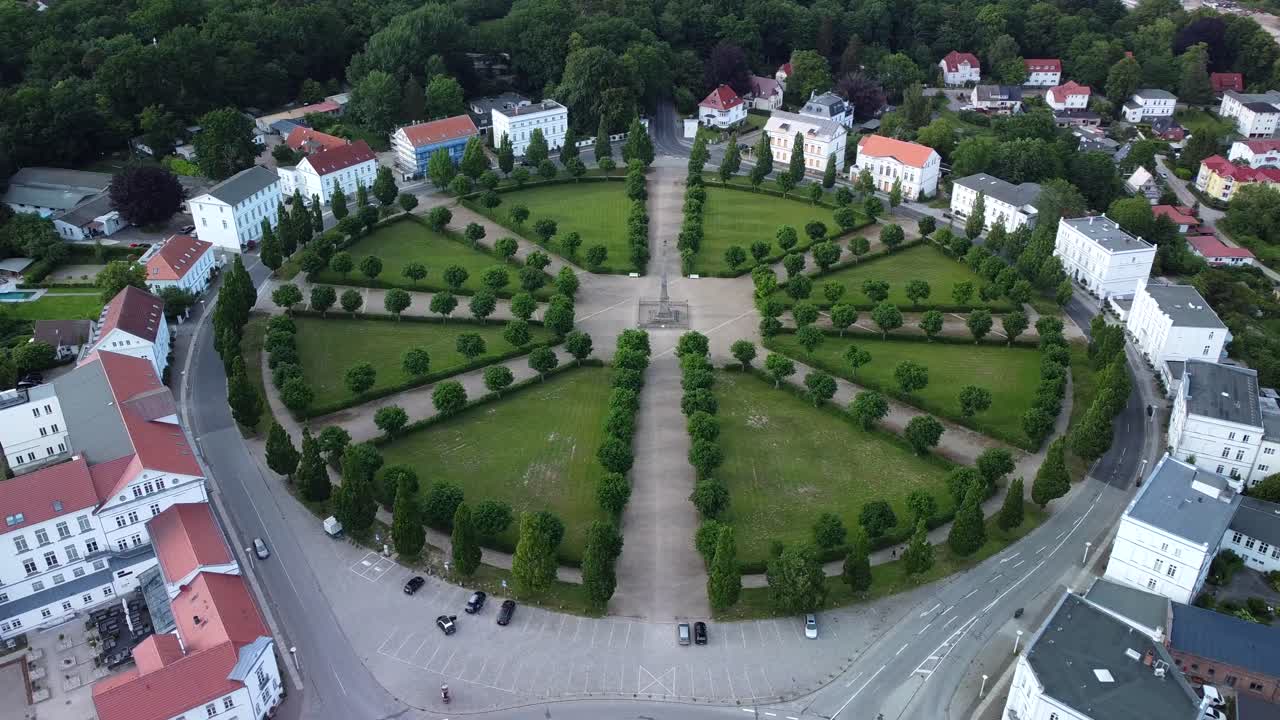 Drone shot, showing the historical classic circus square of Putbus town with white houses, located on the R&uuml;gen Island in Germany