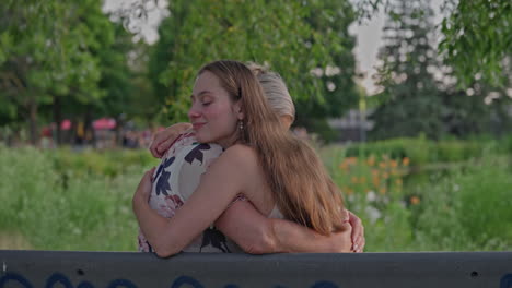 a young woman embraces her mother in a tender hug by a garden pond. her face expresses deep, sincere love and trust. a touching moment captured in natural light with emotional clarity