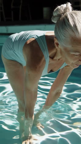 senior woman exercising in a swimming pool