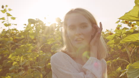 beautiful girl posing for camera in field