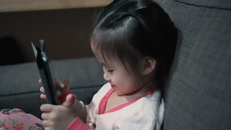 little girl using digital tablet and taking selfie