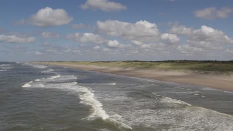 noordwijk’s embrace, land meets tide, pure beauty flows gently and wide