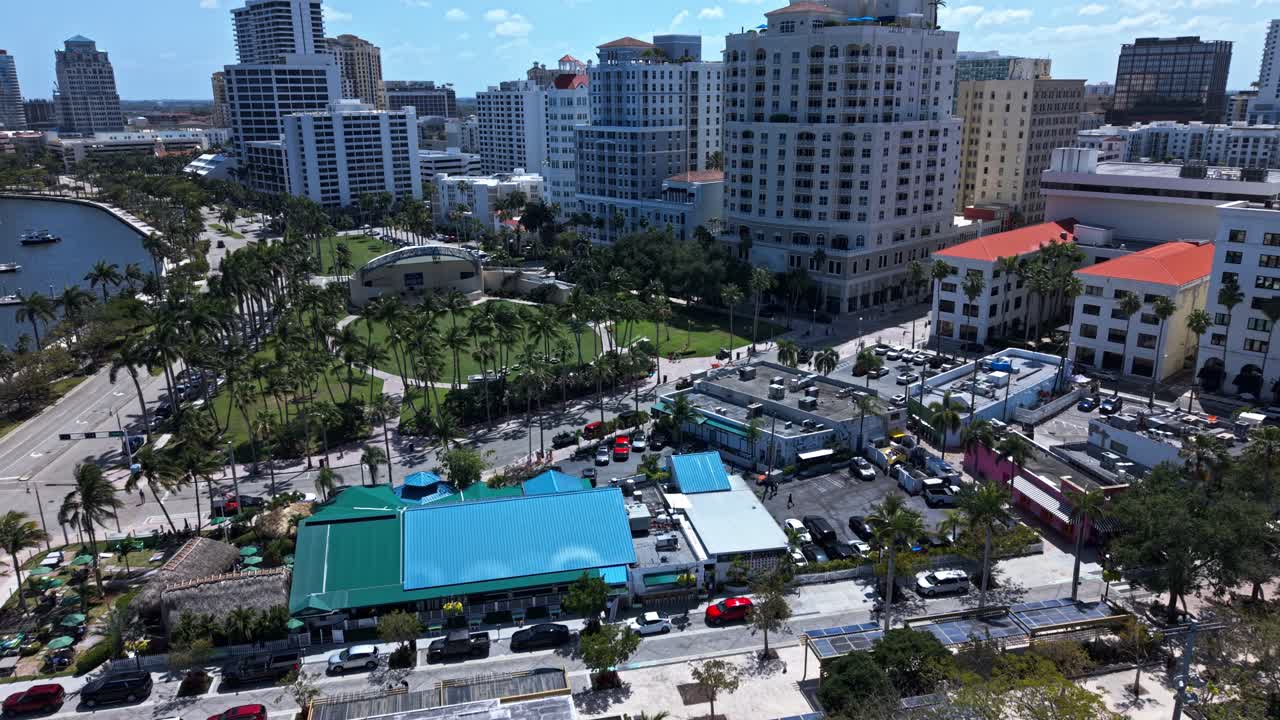 Aerial: downtown West Palm Beach cityscape during the day in Florida, USA, push in drone shot