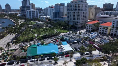 aerial: downtown west palm beach cityscape during the day in florida, usa, push in drone shot