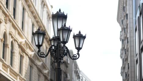 ornate street lamp in a city setting