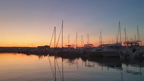 wonderful sunset over marina sveva touristic port. slow-motion