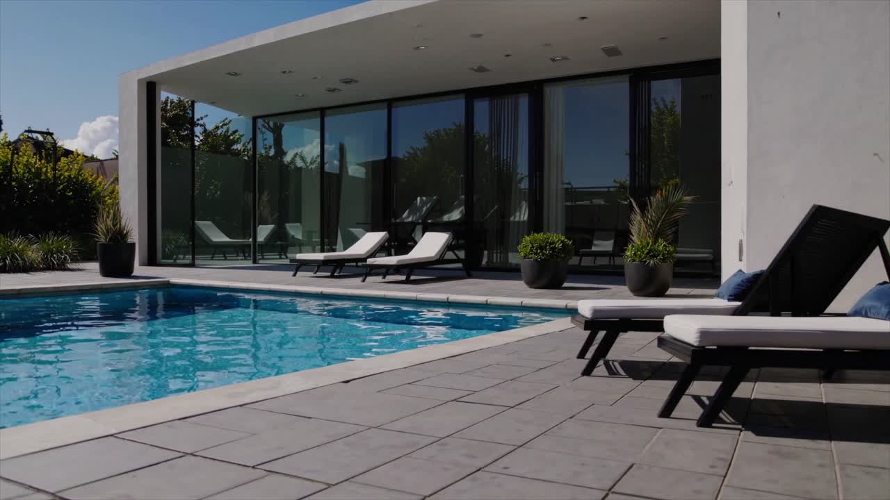 CGI of a chic, minimalist poolside villa, designed for Airbnb and short-term rental investments, featuring a modern, sleek aesthetic ideal for luxury stays.