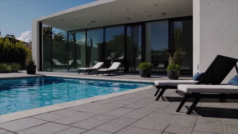 cgi of a chic, minimalist poolside villa, designed for airbnb and short-term rental investments, featuring a modern, sleek aesthetic ideal for luxury stays.