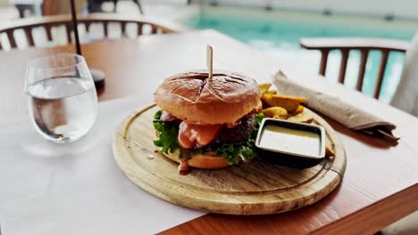 delicious burger by the pool