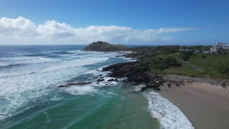 Ocean-Waves-Splashing-On-The-Shore-At-Cabarita-Beach-In-New-South-Wales,-Australia---Drone-Shot