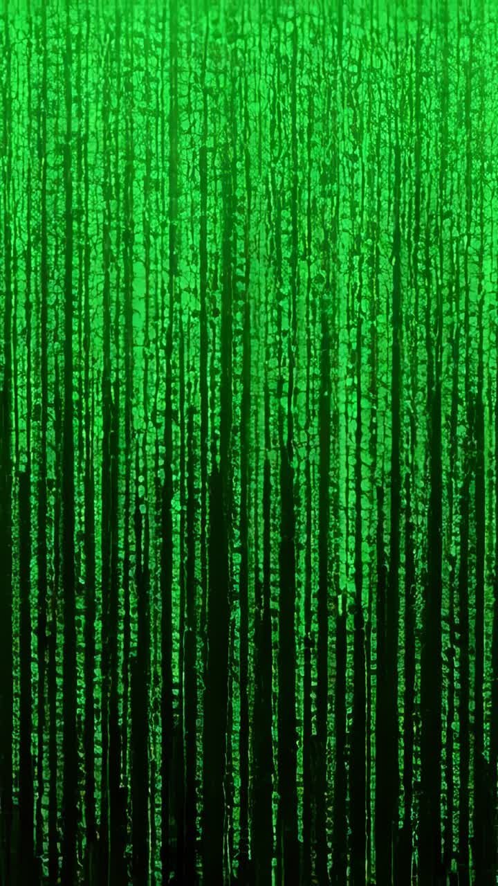 Vertical video: Forming sparse top glyphs, glowing code streams falling on dark field, with noise
