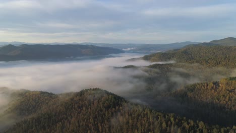 aerial view of mountain range with fog