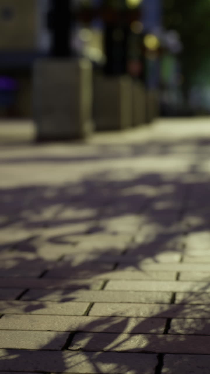 Walking through the city at sunset revealing shadows and textures in bricks