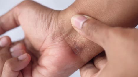 close-up of a person examining their wrist