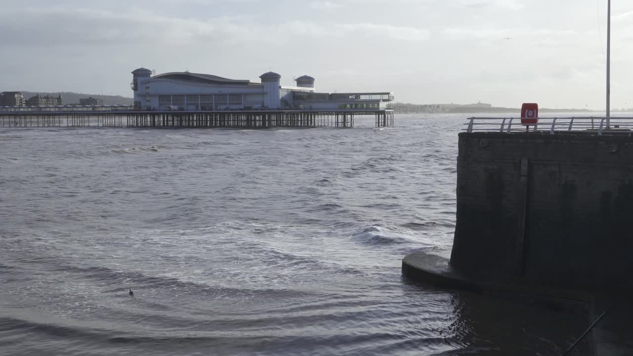 WESTON SUPER MARE, SOMERSET, December 23, 2019: Grand pier with hight tide.