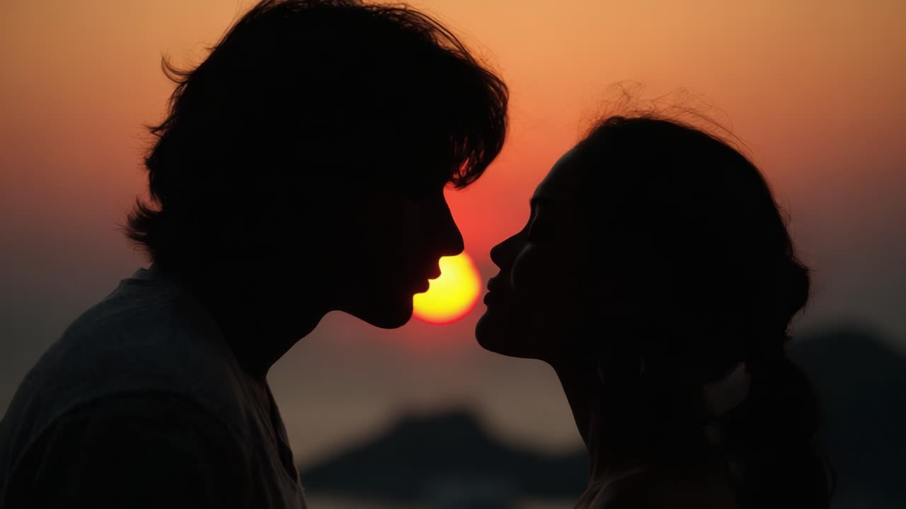 A Romantic Silhouette Against a Stunning Sunset: Capturing an Intimate Moment Between Two Lovers in the Embrace of Nature's Beauty