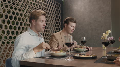 friends enjoying dinner at a restaurant