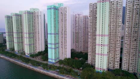 Huge-high-rise-residential-apartments-with-brightly-colored-parts-in-the-ultra-modern-Ma-On-Shan-in-Hong-Kong-on-a-cloudy-summer-evening