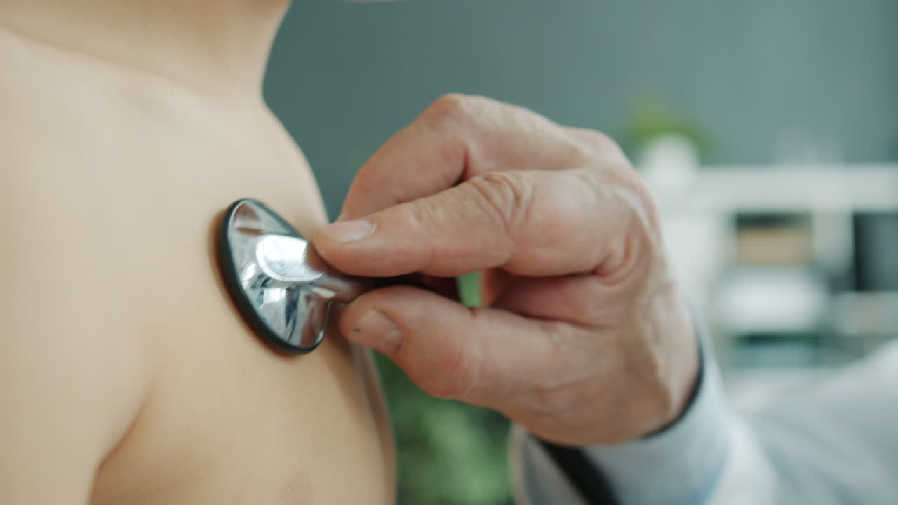 Doctor examining a child's chest with a stethoscope