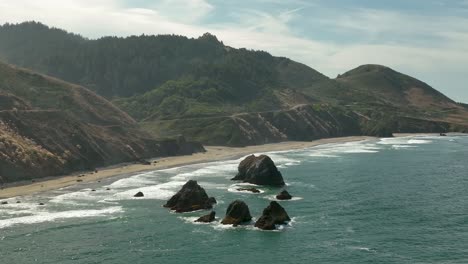 Aerial-view-of-large-rock-islands-off-the-coast-of-Northern-California's-shore