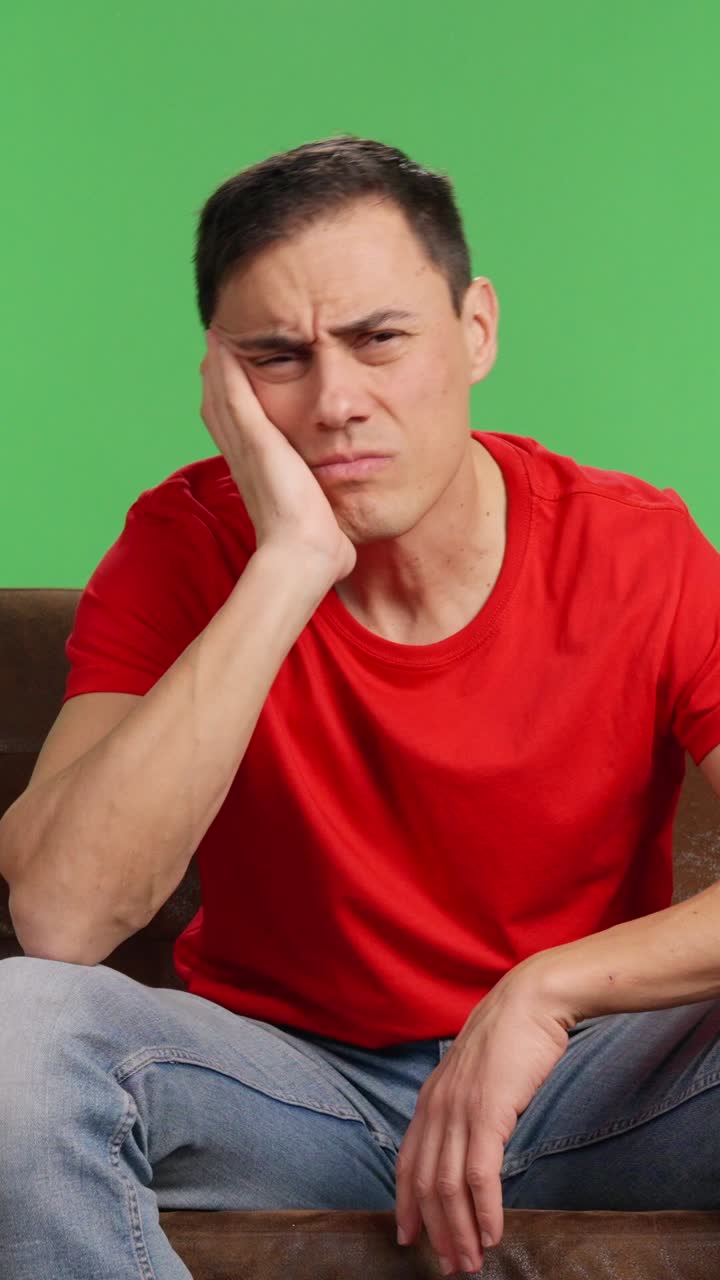 Man starts watching a movie but falls asleep