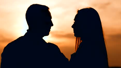 romantic couple silhouettes at sunset with tender moments