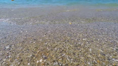 waves of mediterranean sea rolling in sunshine to the sandy beach. beautiful turkish nature.close-up shot of calming foamy water.sea. beach. sand. sky. the beach with close up the sand.landscape view.