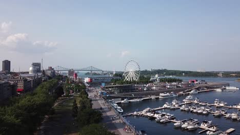 drone approaching old city port in montreal quebec canada aerial footage of metropolitan cityscape