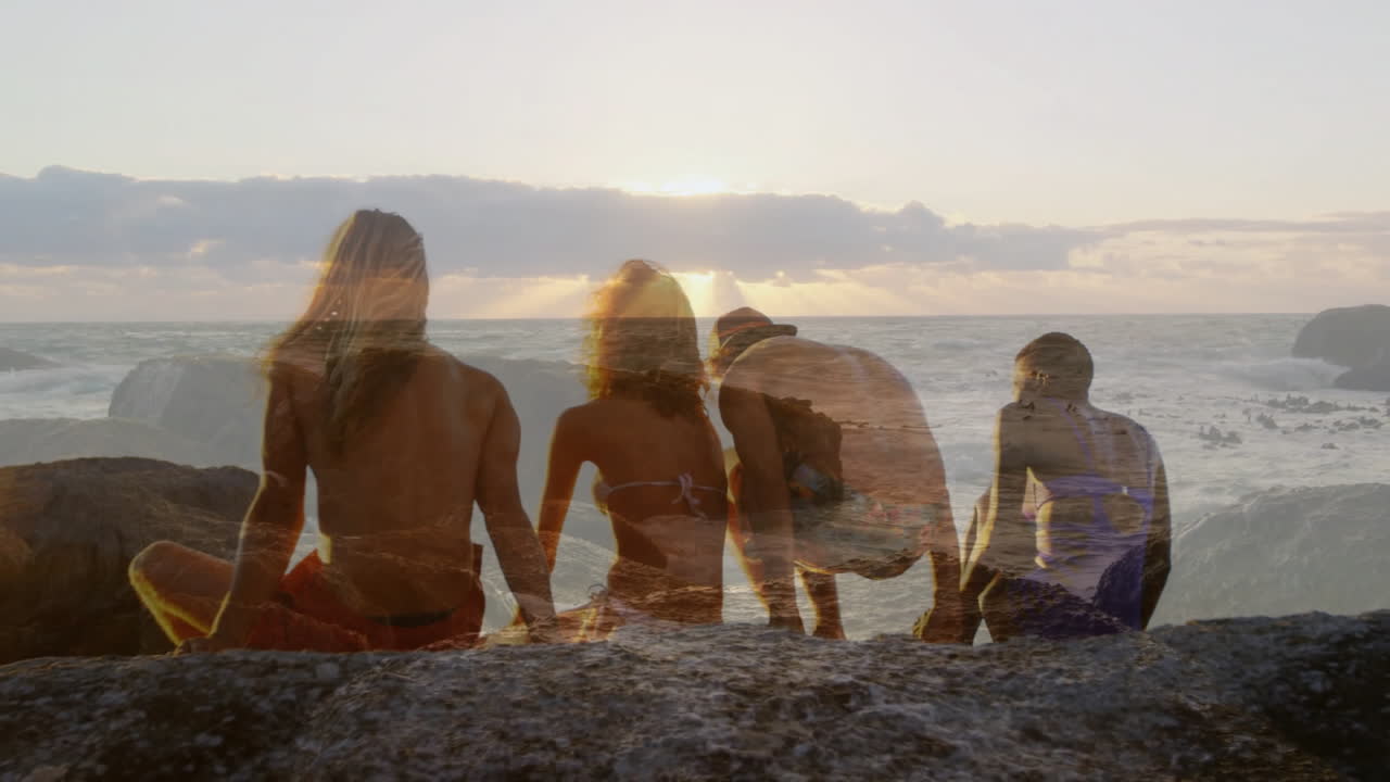Sitting on rocks, four people watching sunset over ocean waves in animation