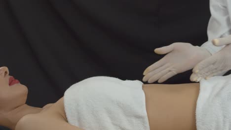 woman at a cosmotology clinic being examined for plastic surgery by a doctor or nurse