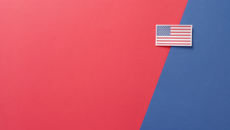 national flag of usa lying on red and blue background with copy space