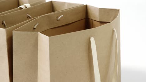 brown shopping bags on white background