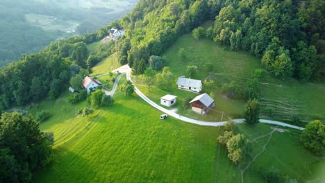 holiday houses and small farms in hills surrounded with green meadows and forest