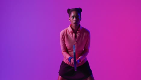 holding tennis racket, person against vibrant pink and purple animation background