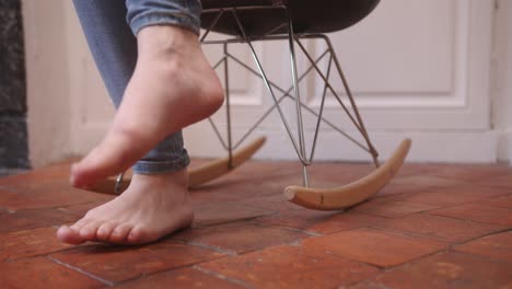 cozy rocking chair indoors with person relaxing on it