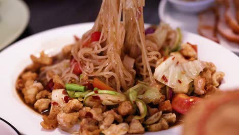 mixing ingredients for a flavorful thai dish