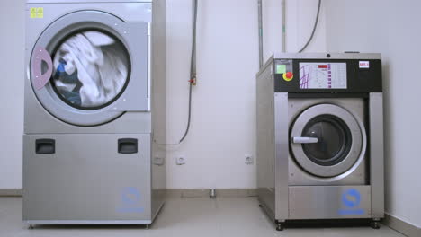 Industrial-washer-dryer-working.-Hotel-laundry-service.-Clothes-dryer-machine