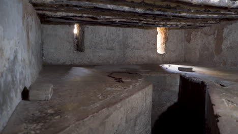 old slave prison dungeon with deep hole in stone town, zanzibar