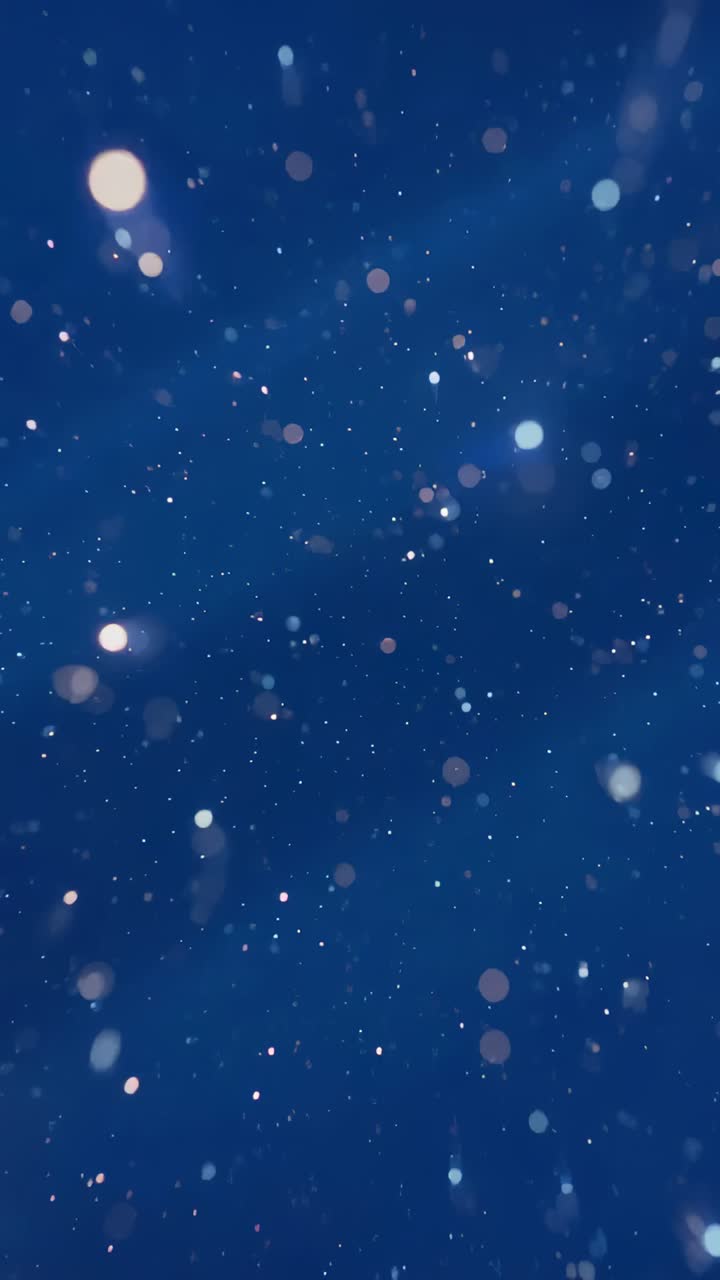Vertical video: Particles gathering, bokeh orbs spiraling inward in ...