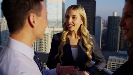 multi ethnic managers discussing strategy overlooking skyscrapers chicago