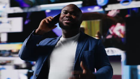African american guy uses phone call connection to showcase engagement