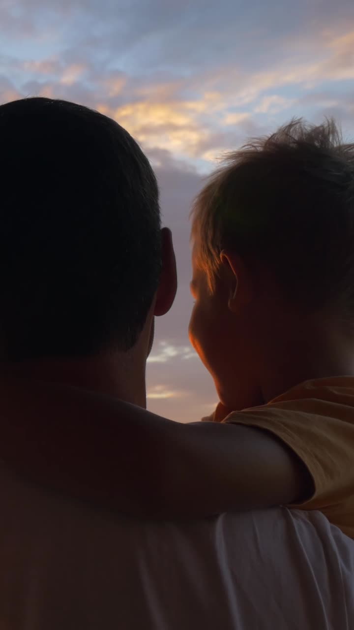 Father and Child Enjoying Sunset Together