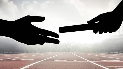 animation of athlete's hands passing relay baton over racing track in sports stadium