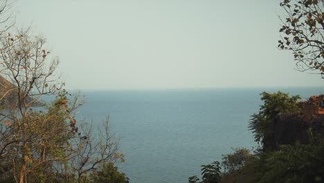 Slow-panning-shot-showing-the-Indian-coastline-disappearing-behind-a-brick-wall