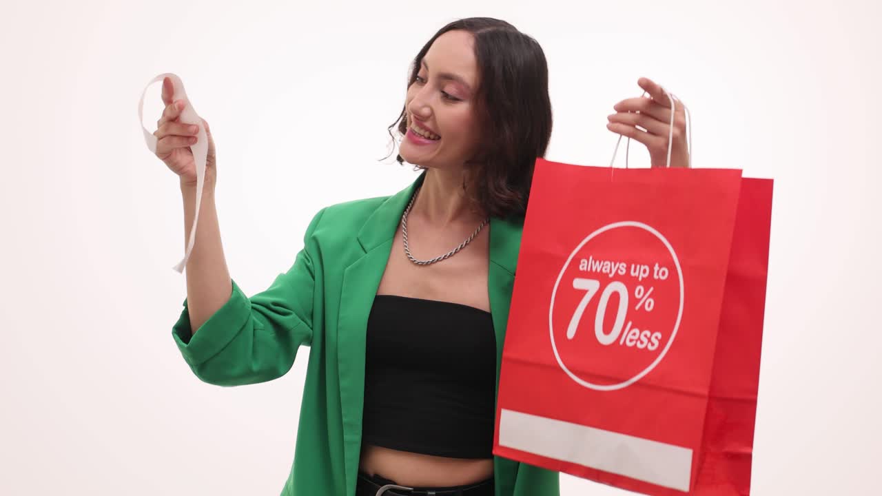Happy Woman with Shopping Bag and Long Receipt Showing Savings