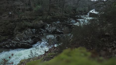 Fast-moving-waterfall-on-Afon-Lledr-river-in-Wales,-Snowdonia,-UK