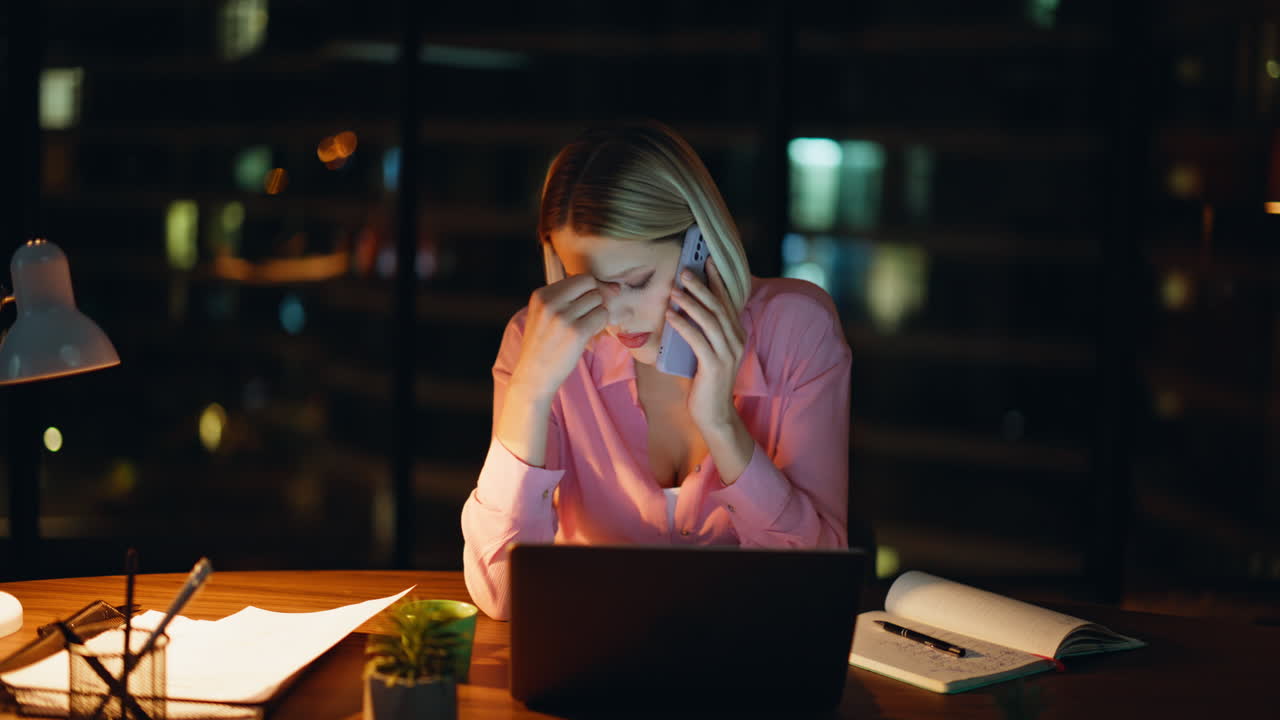 Worried Woman Working Late on Laptop