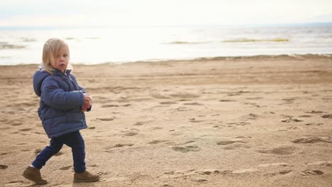 little girl playing on the beach