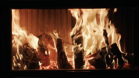 firewood is burning in a modern fireplace 1