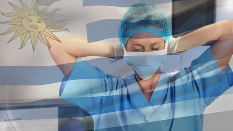 Animation-of-flag-of-uruguay-waving-over-surgeons-in-operating-theatre